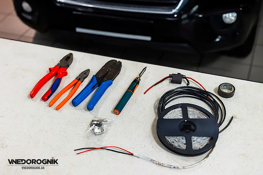 DIY installation kit: LED strip, toggle switch, fuse holder, wire, and terminals.