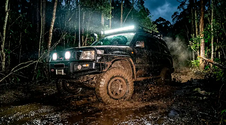 Prepared SUV with an additional LED bar turned on during off-roading